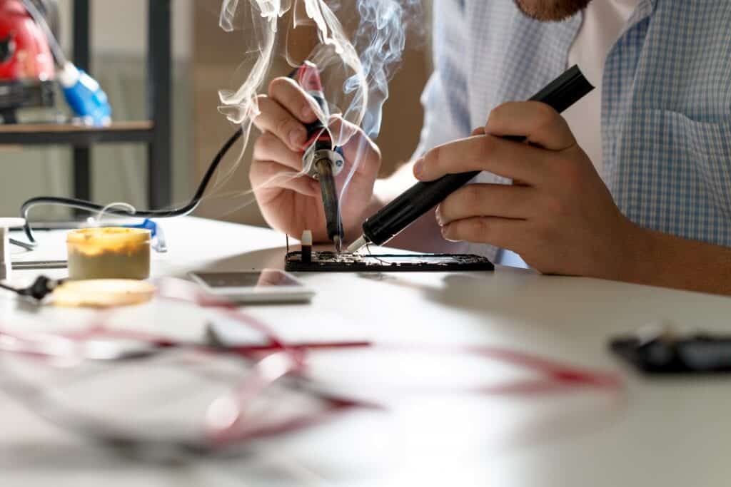 Employee Executing Hand soldering process