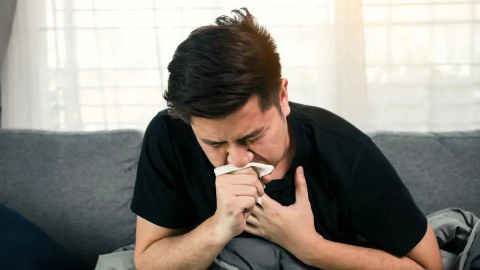 Man in Black Tshirt Coughing