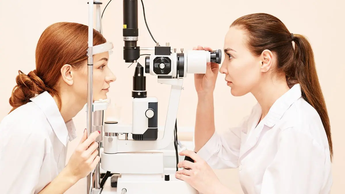 An Eye Specialist Looking At Patient's Eyes